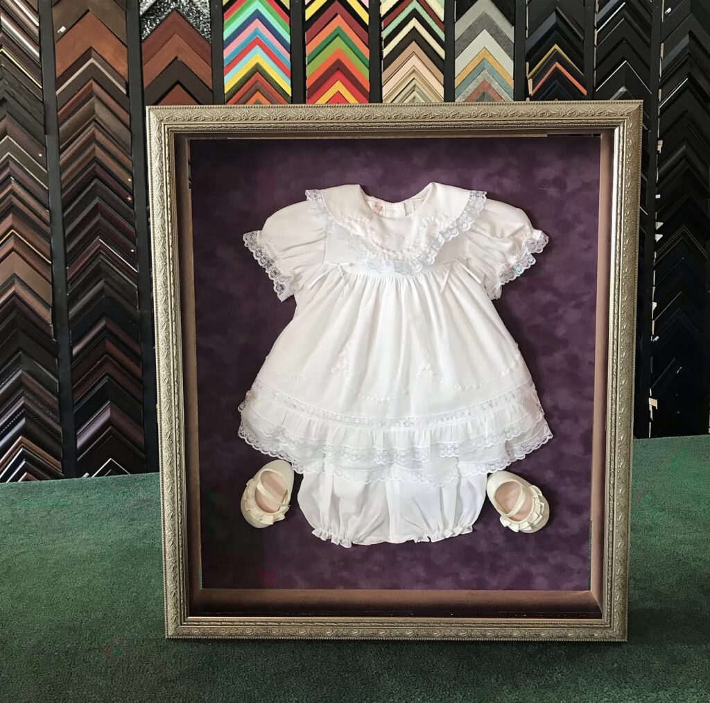 Custom framed baby outfit museum shadow box preservation keepsake