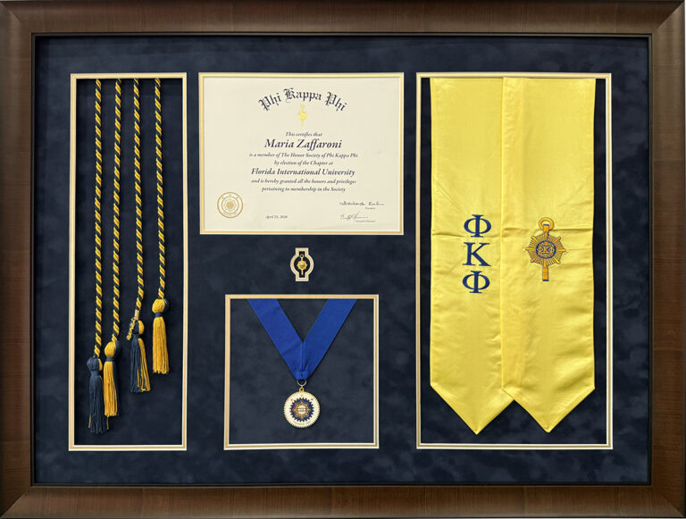 Custom graduation memorabilia framing in Pembroke Pines with diploma, medal, cords, and sash
